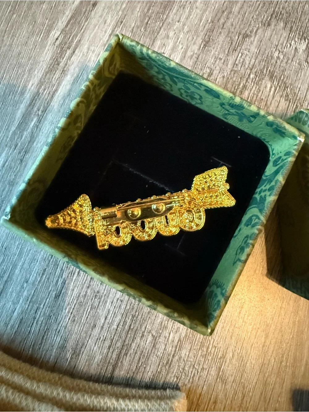 Gold Brooch and GG Designed Socks